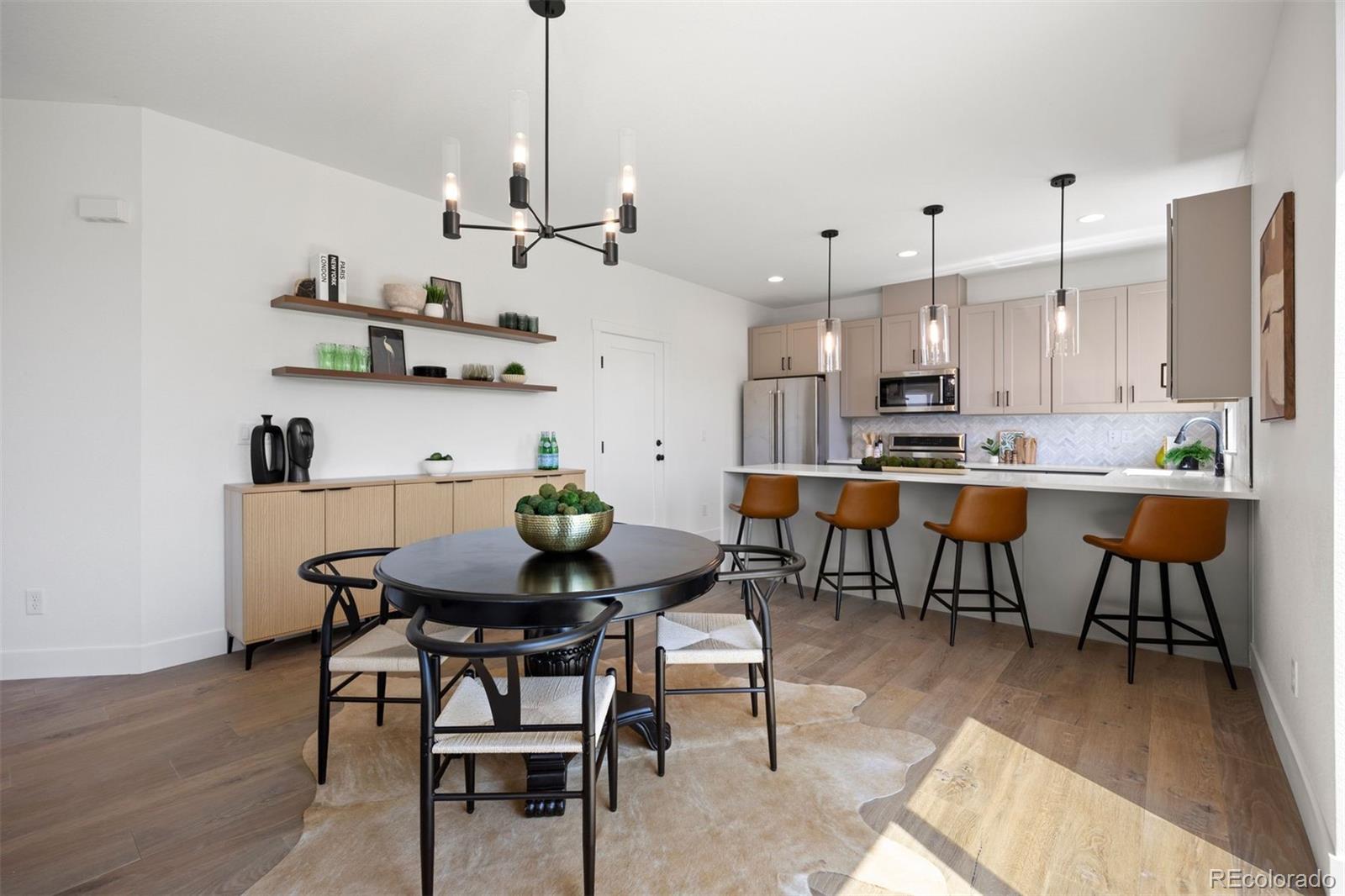 4026 Upham Street Wheat Ridge, CO 80033 - Photo 16 of 50 a view of a dining room with furniture