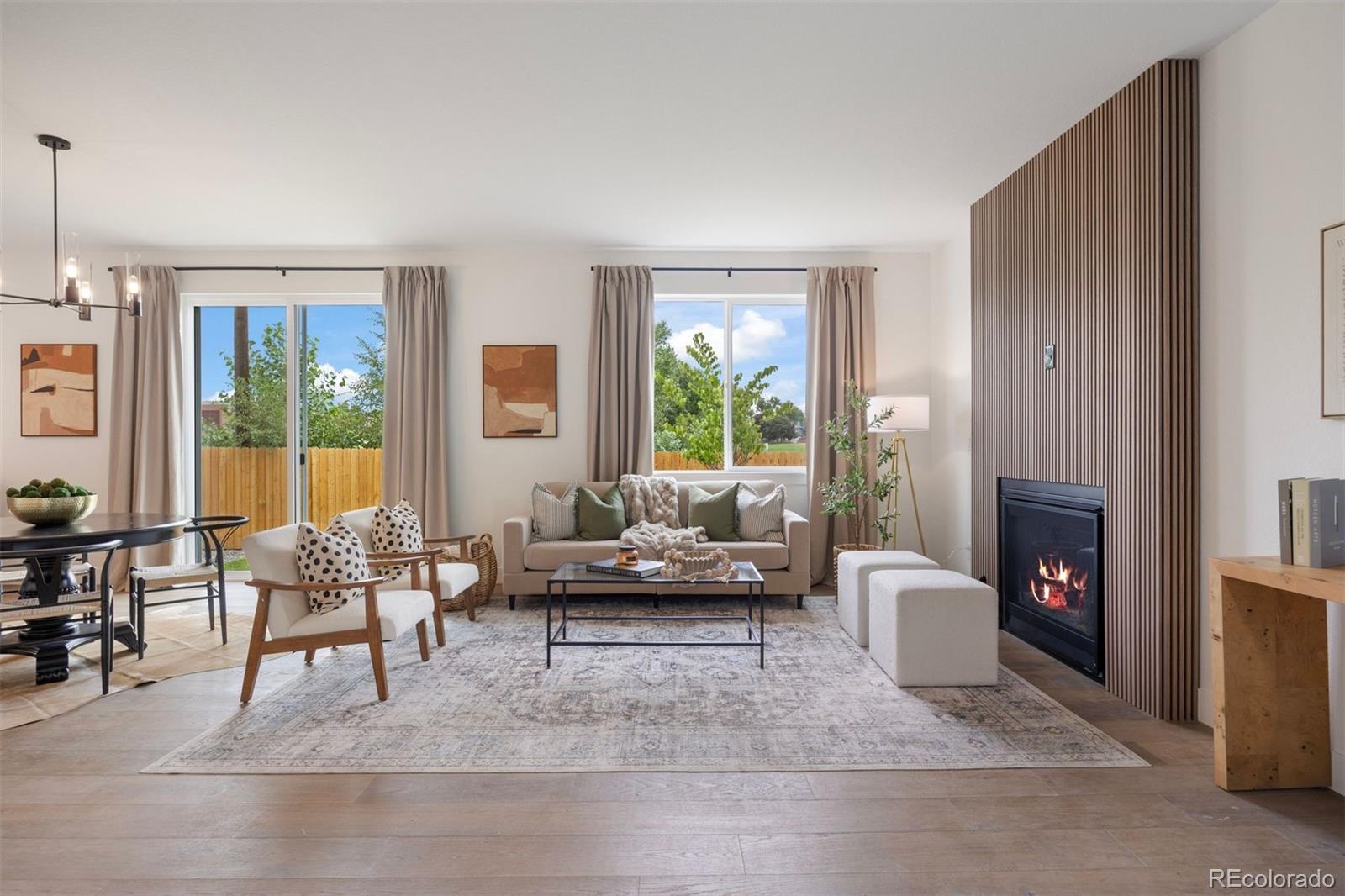 4026 Upham Street Wheat Ridge, CO 80033 - Photo 3 of 50 a living room with furniture and a fireplace
