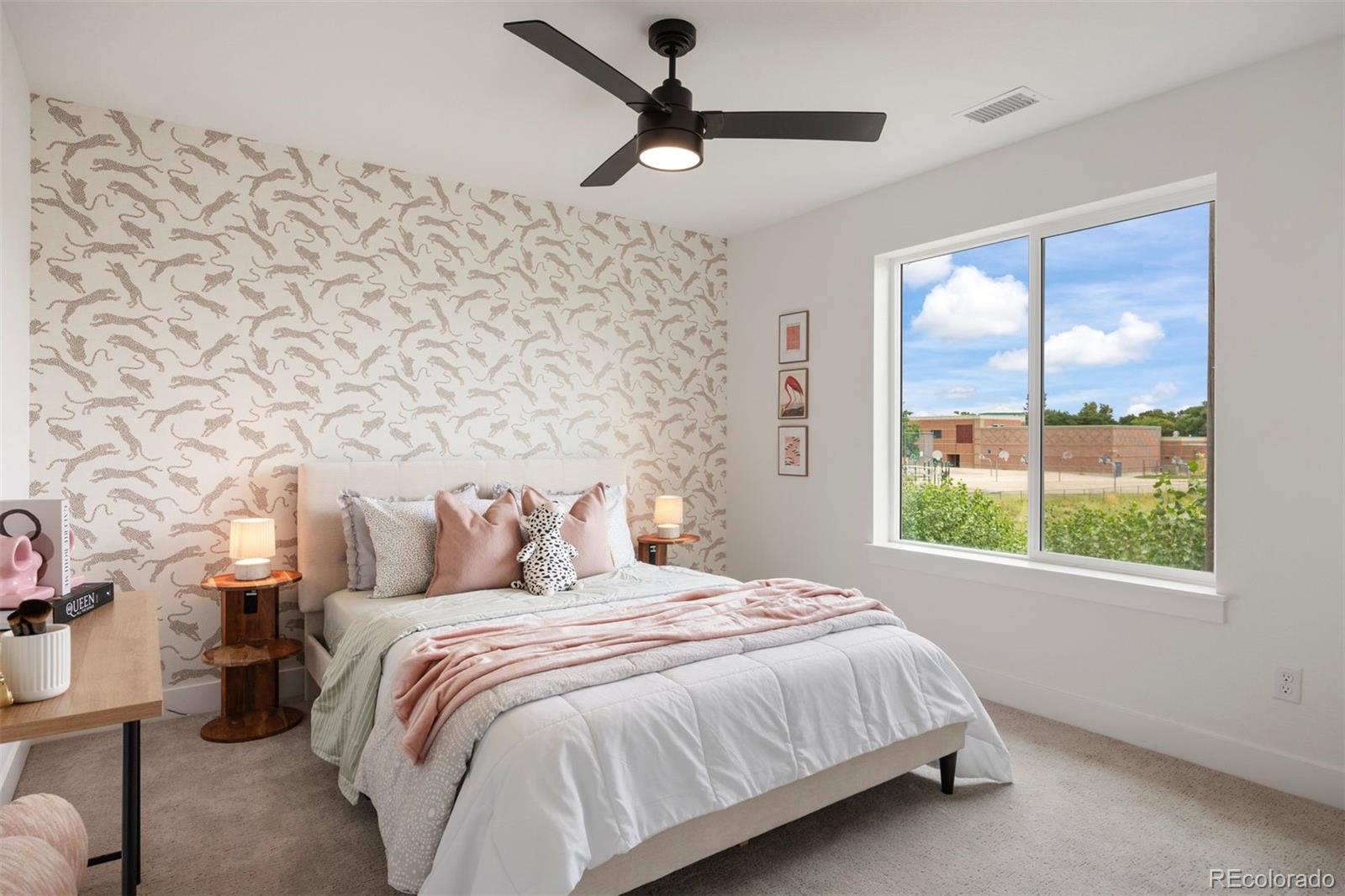 4026 Upham Street Wheat Ridge, CO 80033 - Photo 32 of 50 a bedroom with a bed and a window