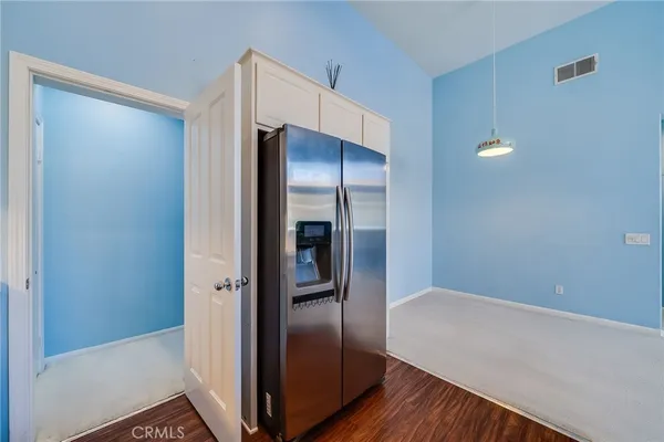 a view of a hallway with bathroom
