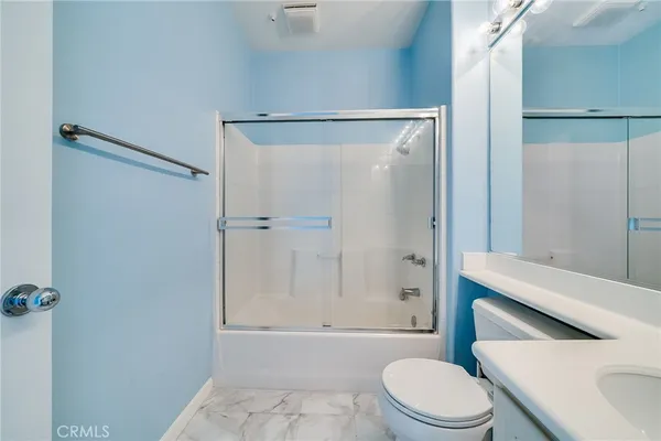 a big room with windows and closet