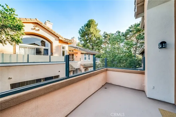 an entrance of a house with a door and a yard