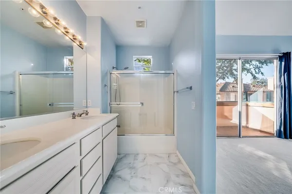 a bathroom with a double vanity sink mirror and double