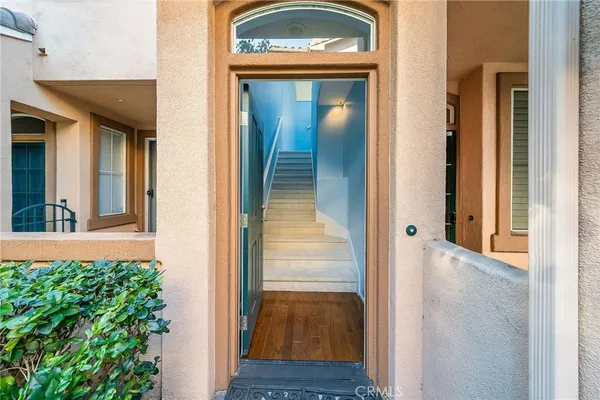 a view of a glass door with a balcony