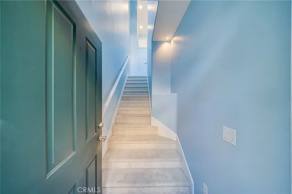 a view of empty room with a fireplace