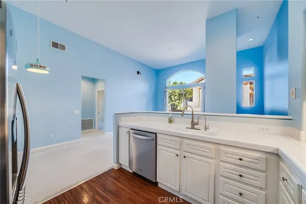 a view of hallway with cabinets