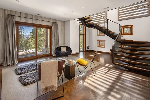 a bedroom with a large bed and a large window