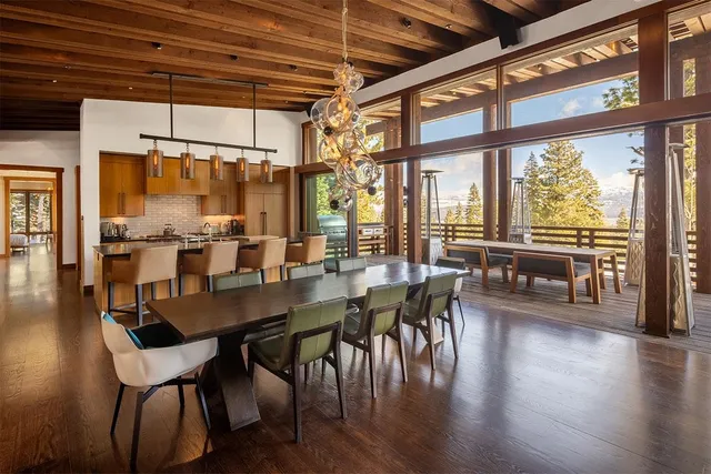 a dining table with chairs and wooden floor