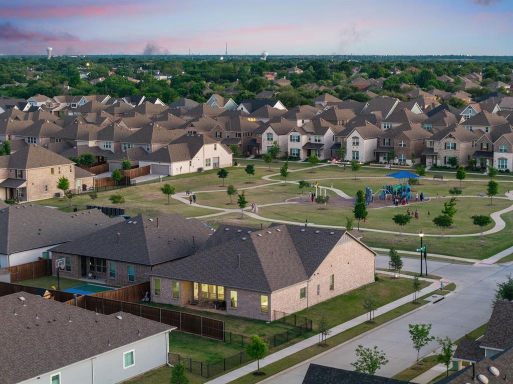 8808 Royal Star Road Rowlett, TX 75089 - Photo 7 of 40 an aerial view of multiple houses with yard