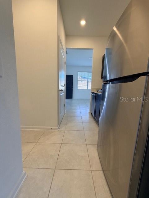 352 Kayden Cove Lake Wales, FL 33859 - Photo 15 of 32 a view of hallway with a window and a refrigerator