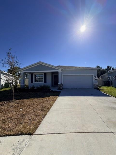 352 Kayden Cove Lake Wales, FL 33859 - Photo 2 of 32 a front view of a house with a yard