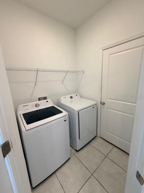 352 Kayden Cove Lake Wales, FL 33859 - Photo 25 of 32 a utility room with dryer and washer