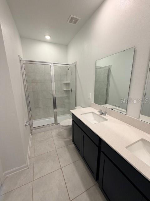 352 Kayden Cove Lake Wales, FL 33859 - Photo 29 of 32 a bathroom with a double vanity sink mirror and shower