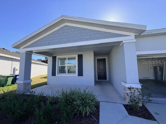 352 Kayden Cove Lake Wales, FL 33859 - Photo 3 of 32 a house view with a garden space