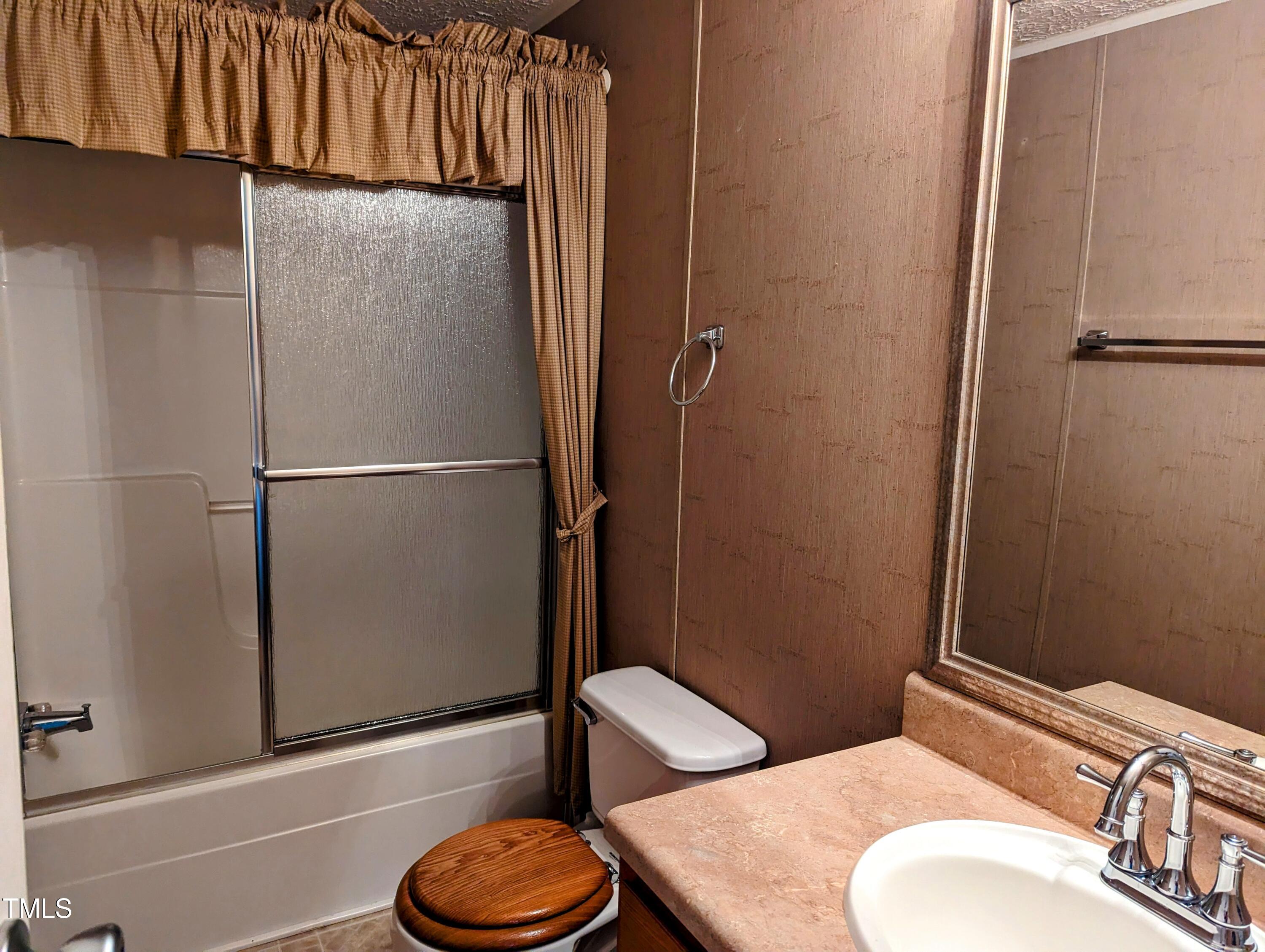 271 Buoy Drive Henderson, NC 27537 - Photo 16 of 21 a bathroom with a toilet and a sink