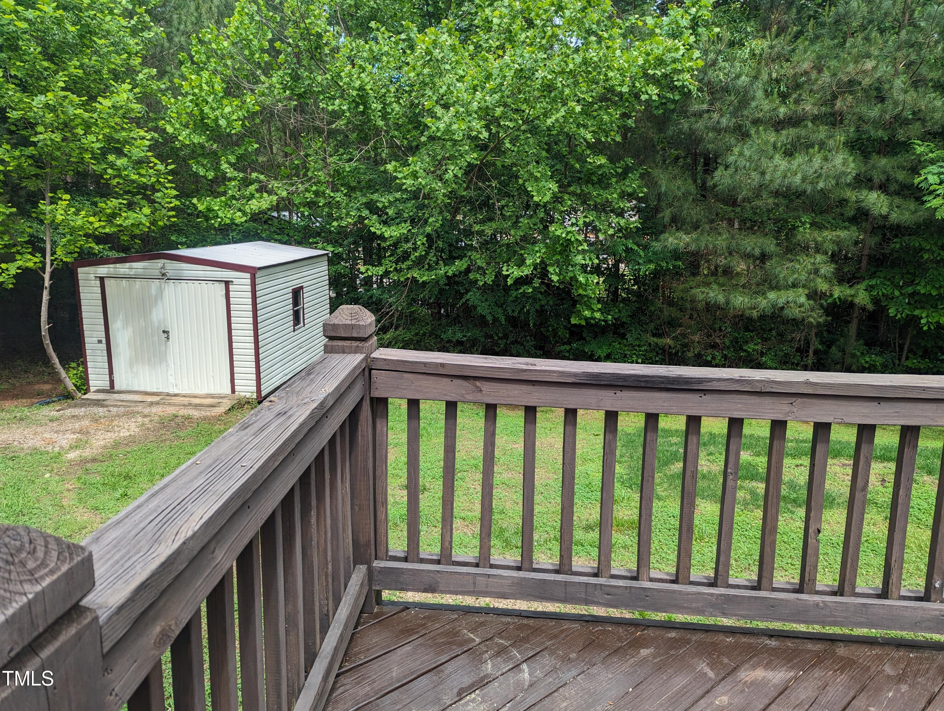 271 Buoy Drive Henderson, NC 27537 - Photo 19 of 21 a balcony with trees in front of it