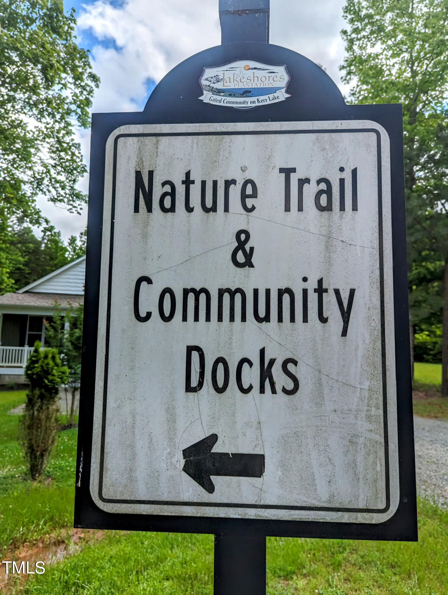 271 Buoy Drive Henderson, NC 27537 - Photo 21 of 21 a view of outdoor space with garden and tall trees