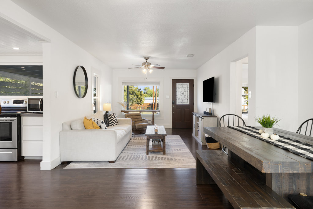 102 Ranchview Drive Johnson City, TX 78636 - Photo 13 of 37 a living room with furniture a fireplace and a flat screen tv