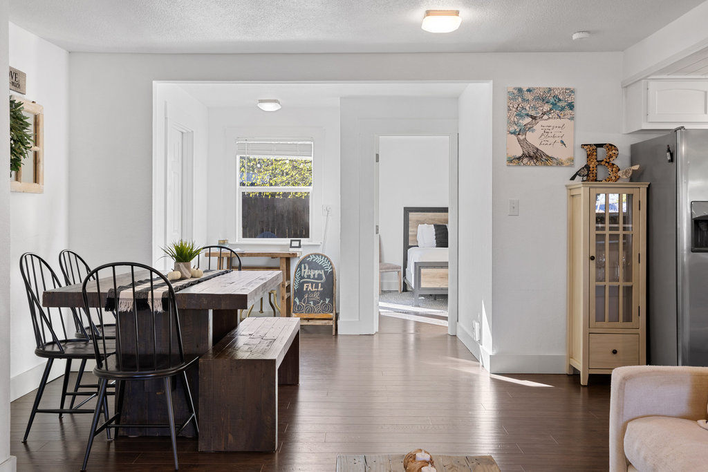 102 Ranchview Drive Johnson City, TX 78636 - Photo 14 of 37 a view of a a dining room with furniture window and wooden floor