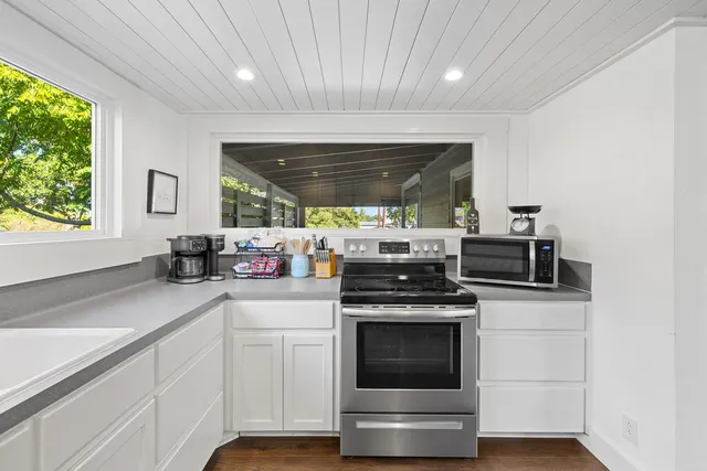 a kitchen with a stove and a sink