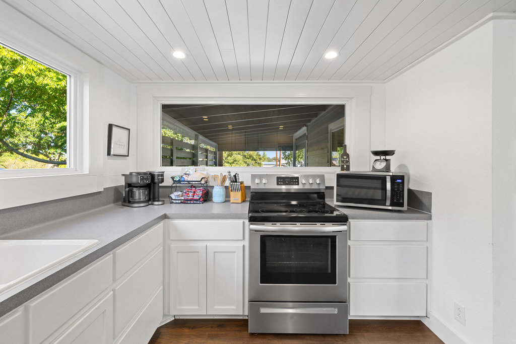 102 Ranchview Drive Johnson City, TX 78636 - Photo 18 of 37 a kitchen with a stove and a sink