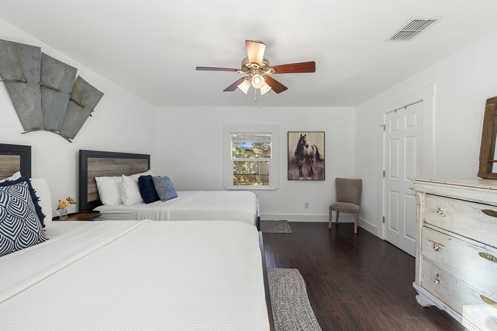 102 Ranchview Drive Johnson City, TX 78636 - Photo 26 of 37 a bedroom with a bed and wooden floor