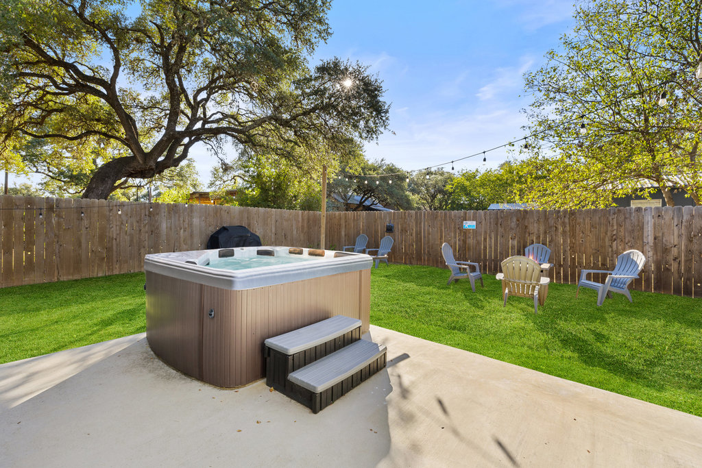 102 Ranchview Drive Johnson City, TX 78636 - Photo 31 of 37 Fenced backyard featuring a hot tub and a patio