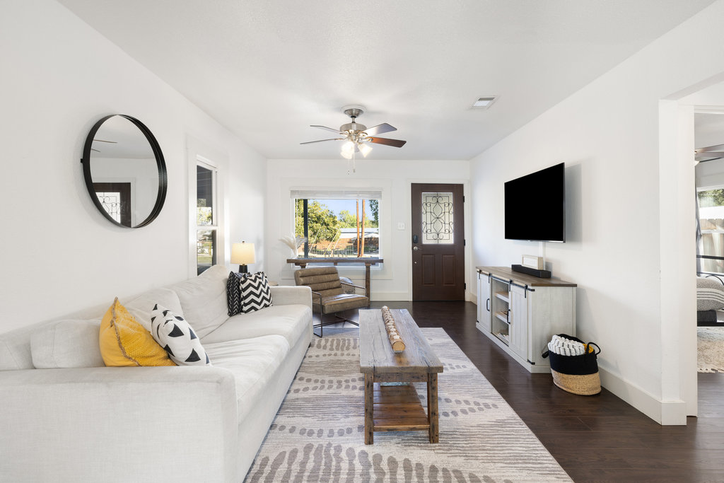 102 Ranchview Drive Johnson City, TX 78636 - Photo 6 of 37 a living room with furniture a flat screen tv and a rug
