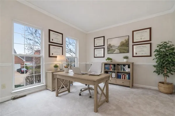 a workspace with furniture and a potted plant