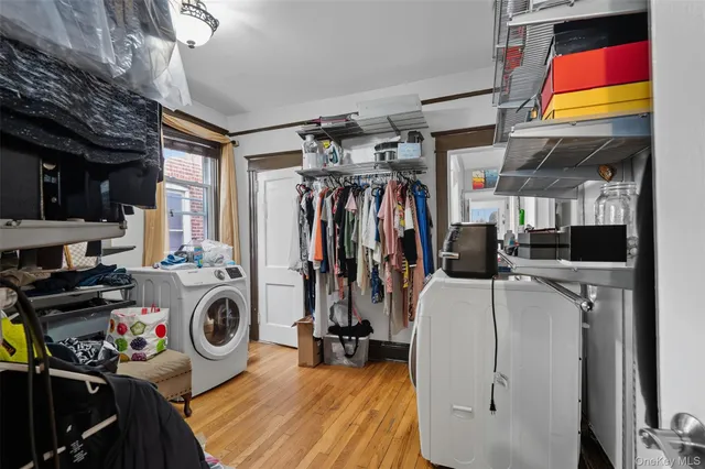 a view of a storage and utility room with washer and dryer