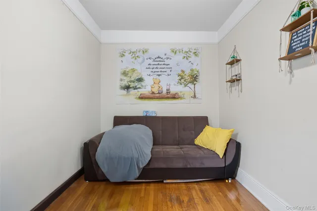 a room with baby crib and furniture