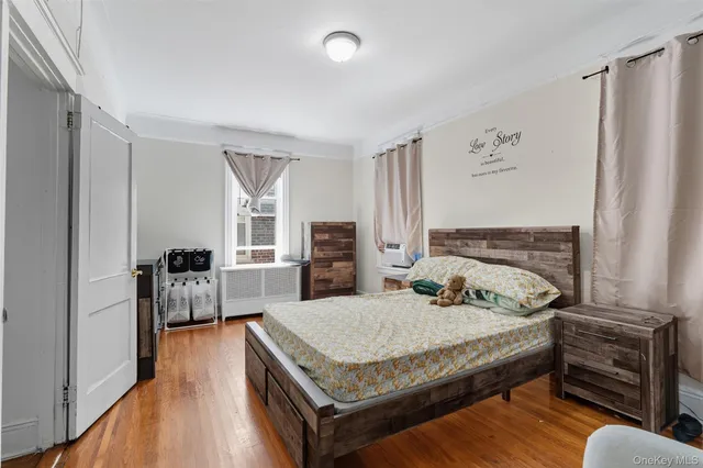 a bedroom with bed and window