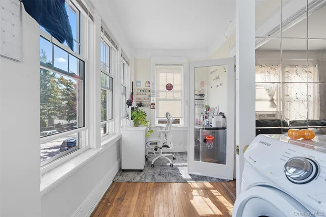a view of a brick house with large windows