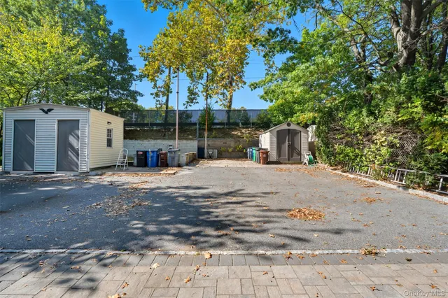 a front view of a house with a yard and fence