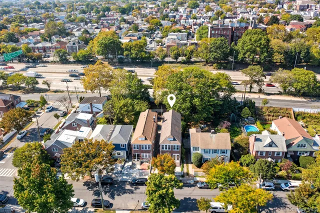 a kitchen with granite countertop a refrigerator and a stove top oven