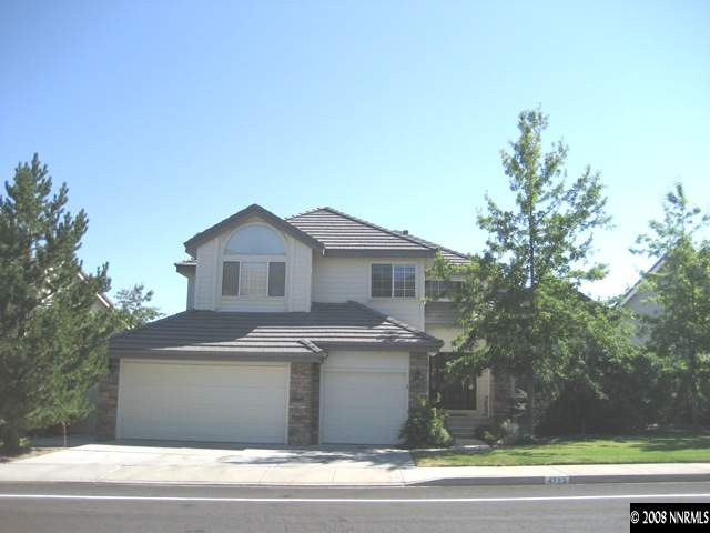 4723 Village Reno, NV 89519 - Photo 1 of 9 a front view of a house with a garage