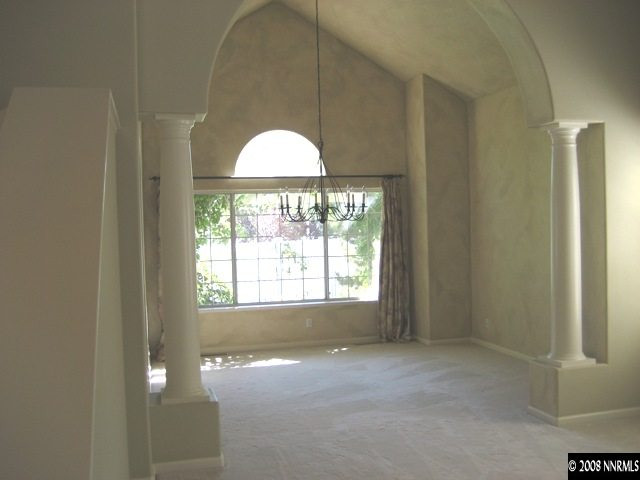 4723 Village Reno, NV 89519 - Photo 3 of 9 a view of empty room with window and chandelier
