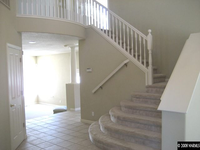4723 Village Reno, NV 89519 - Photo 4 of 9 a view of entryway and hall with wooden floor