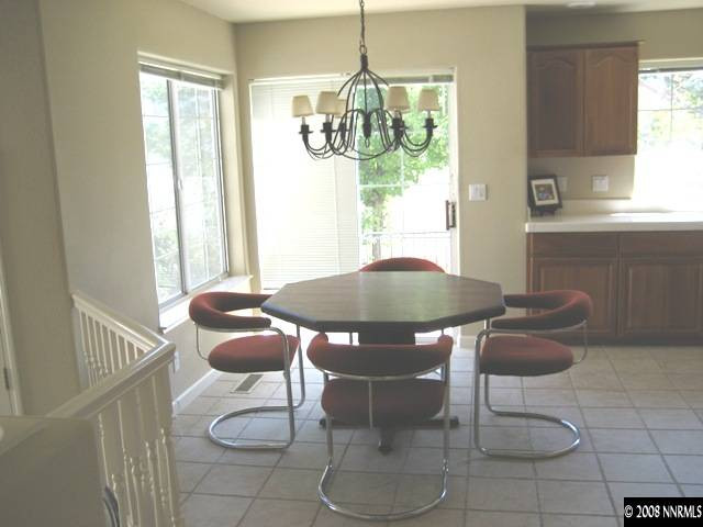 4723 Village Reno, NV 89519 - Photo 7 of 9 a table and chairs in a room
