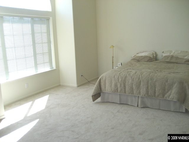 4723 Village Reno, NV 89519 - Photo 8 of 9 a room with a bed and a window