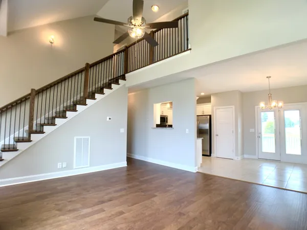 a view of an entryway with wooden floor