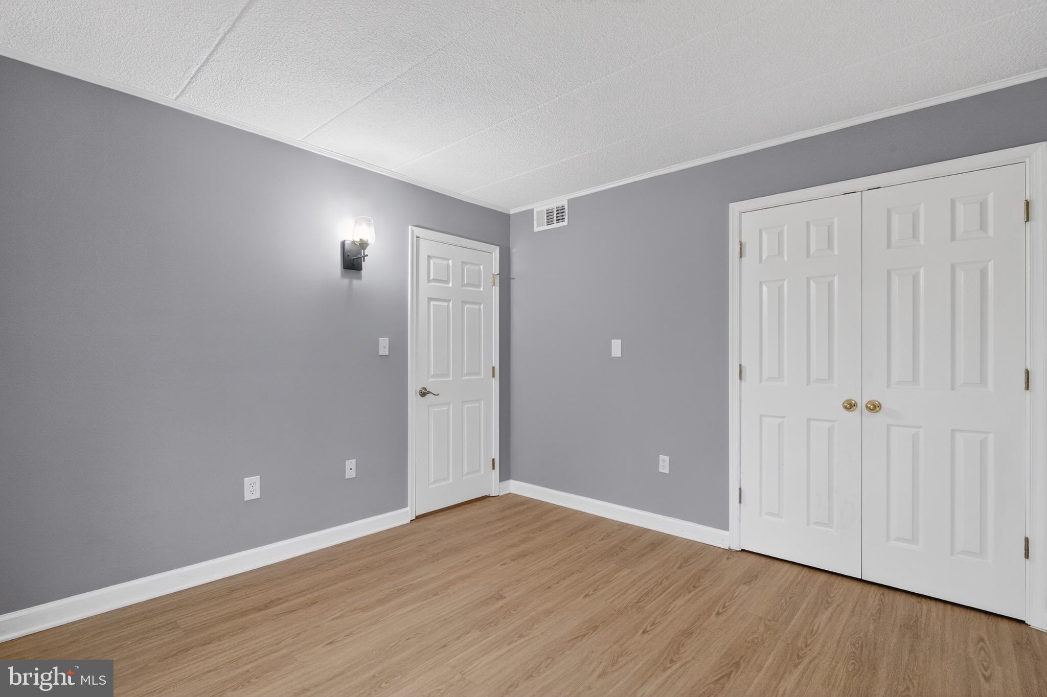 3301 Hewitt Avenue, Unit 403 Silver Spring, MD 20906 - Photo 14 of 19 Versatile space with modern gray walls.