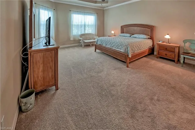 a bedroom with a bed and a dresser in it