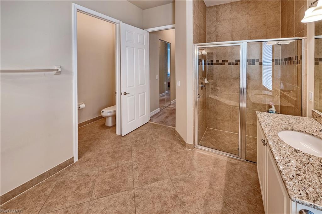 6623 Monterey Point Naples, FL 34105 - Photo 15 of 34 a view of a bathroom with a glass door shower