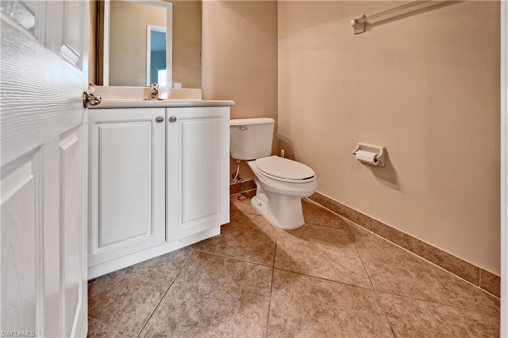 6623 Monterey Point Naples, FL 34105 - Photo 17 of 34 a bathroom with a toilet and a mirror
