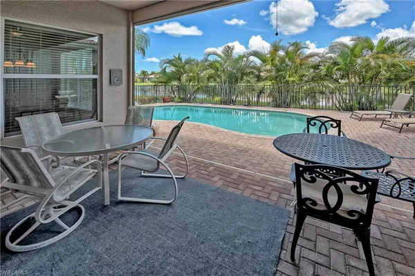 a patio with table and chairs