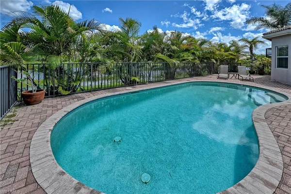 a view of a swimming pool with a patio