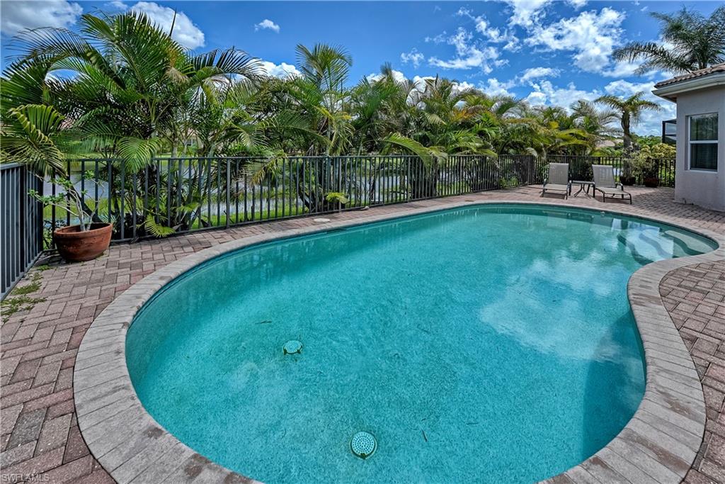 6623 Monterey Point Naples, FL 34105 - Photo 24 of 34 a view of a swimming pool with a patio