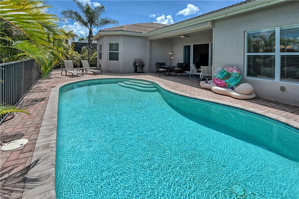 6623 Monterey Point Naples, FL 34105 - Photo 25 of 34 a house view with a sitting space and garden