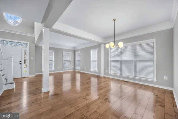 a kitchen with a sink a counter and cabinets